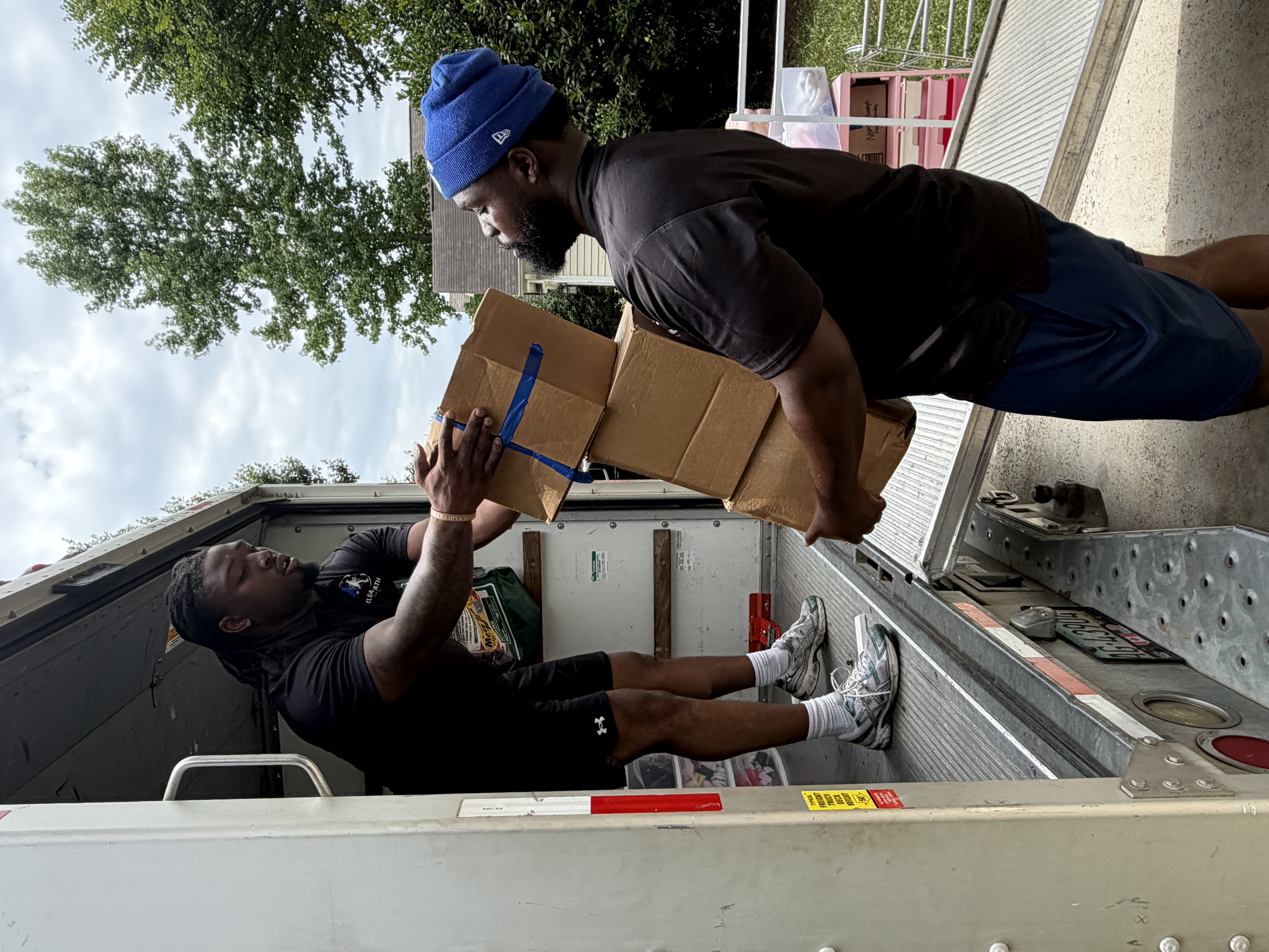 Clear Path Movers crew handing off boxes on move day